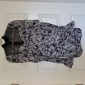 In the style blue floral mini dress with long sleeves and mesh at top. Size 10.